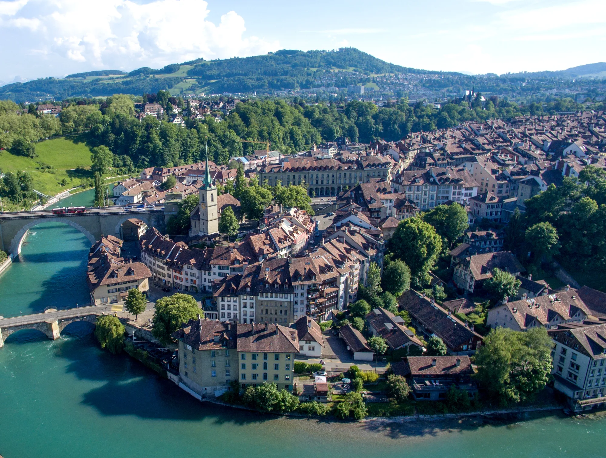Aerial view of Bern's Old Town peninsula wrapped by the turquoise loop of the Aare