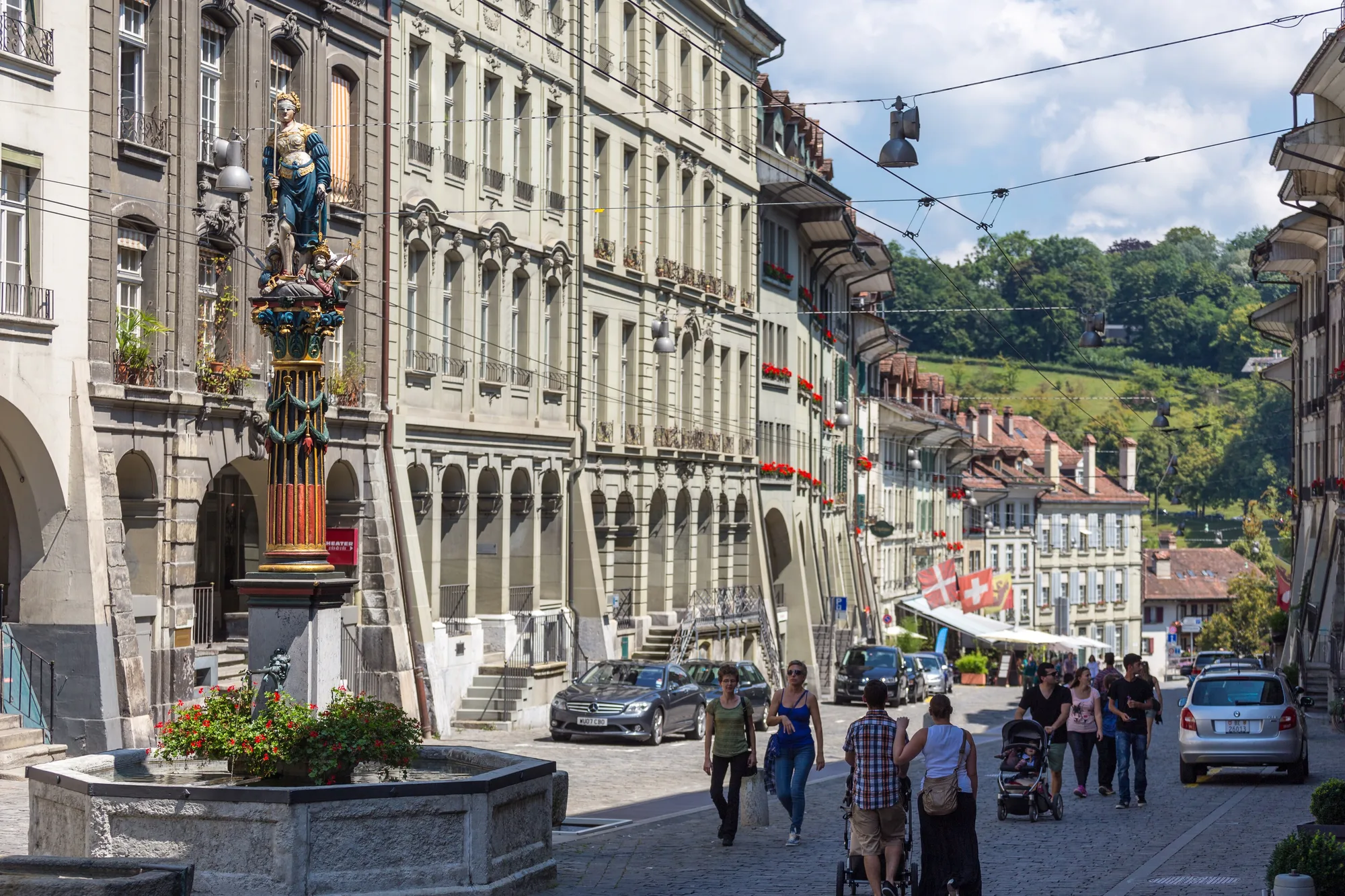 The gilded Justice fountain on the arcaded Gerechtigkeitsgasse in Bern's Old Town